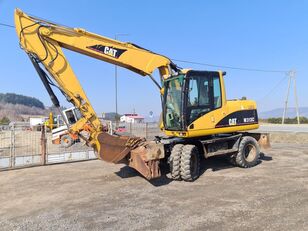 Caterpillar CAT 313 C wheel excavator